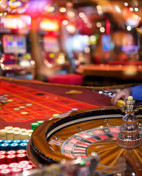 maxwin777 live dealer studio with professional lighting and multiple camera angles showing real dealers at gaming tables
