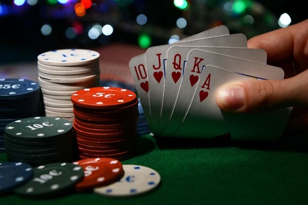 Multilingual dealer studio showing Indonesian and English text overlays during live baccarat game